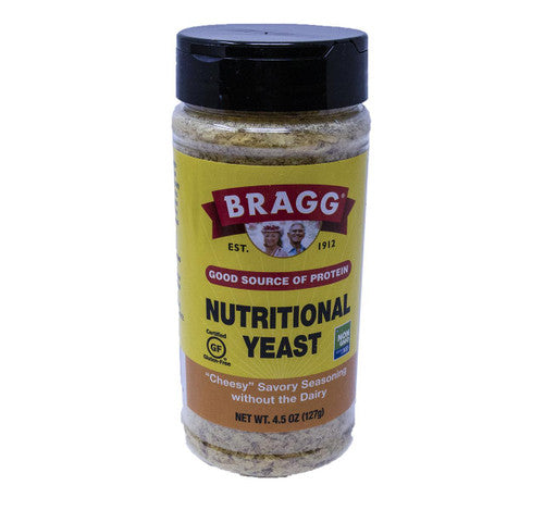 Bottle of Bragg nutritional yeast on a white background