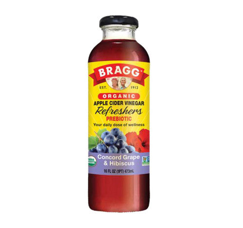 Bragg Organic Apple Cider Vinegar bottle with yellow label on a white background