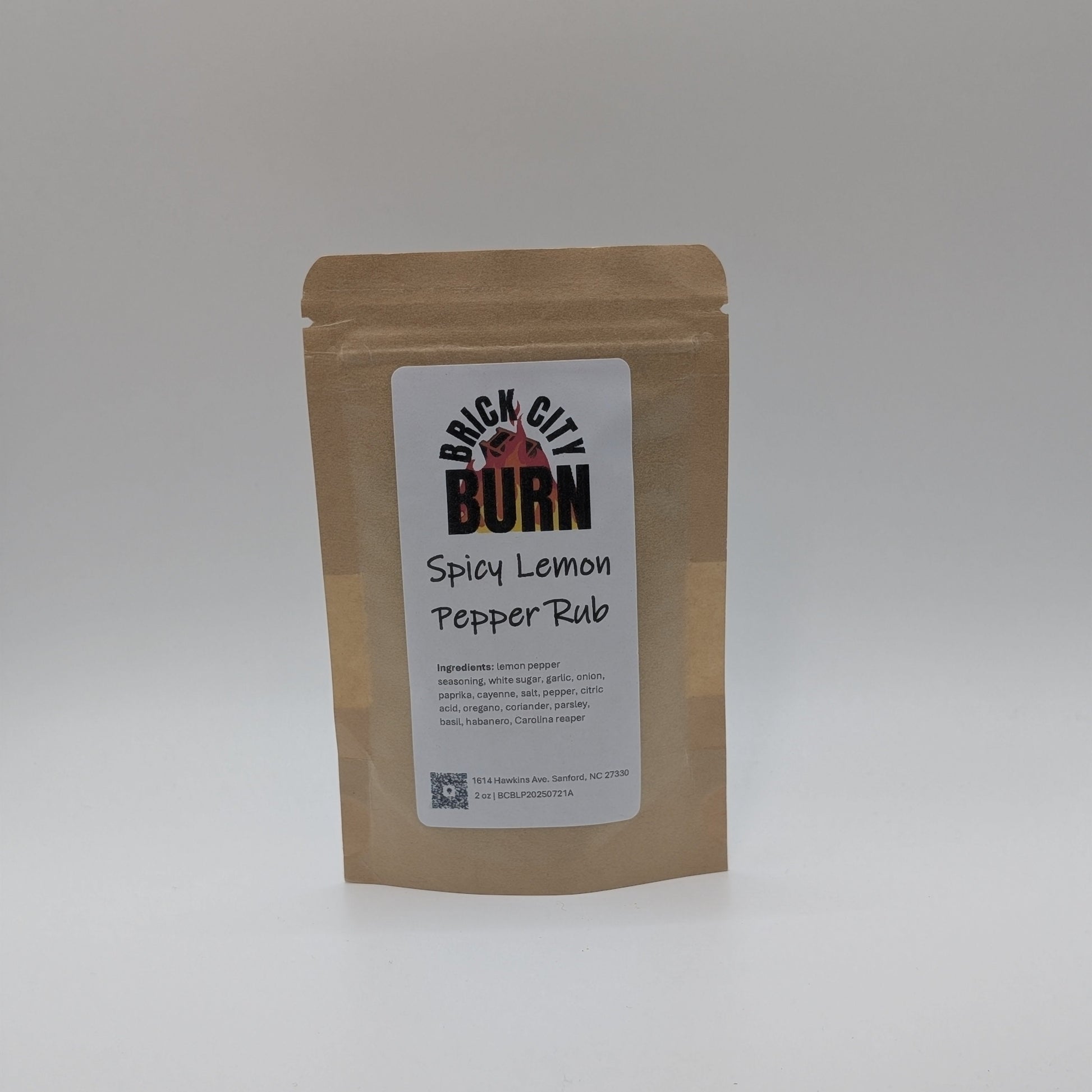 Kraft paper packaging with a label for Brick City Burn Spicy Lemon Pepper Rub on a white background