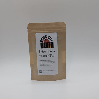 Kraft paper packaging with a label for Brick City Burn Spicy Lemon Pepper Rub on a white background
