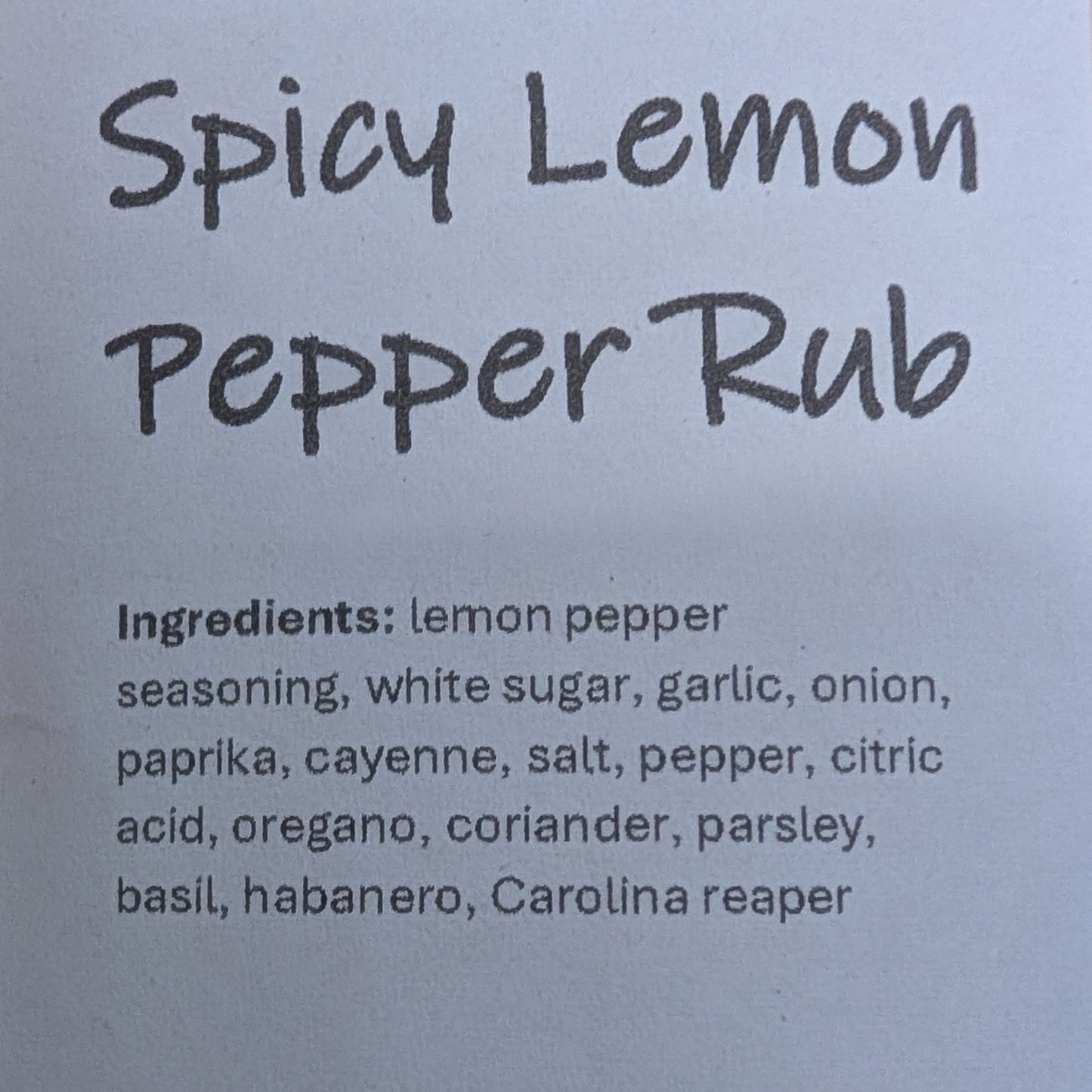 Spicy Lemon Pepper Rub packaging with label on a brown background