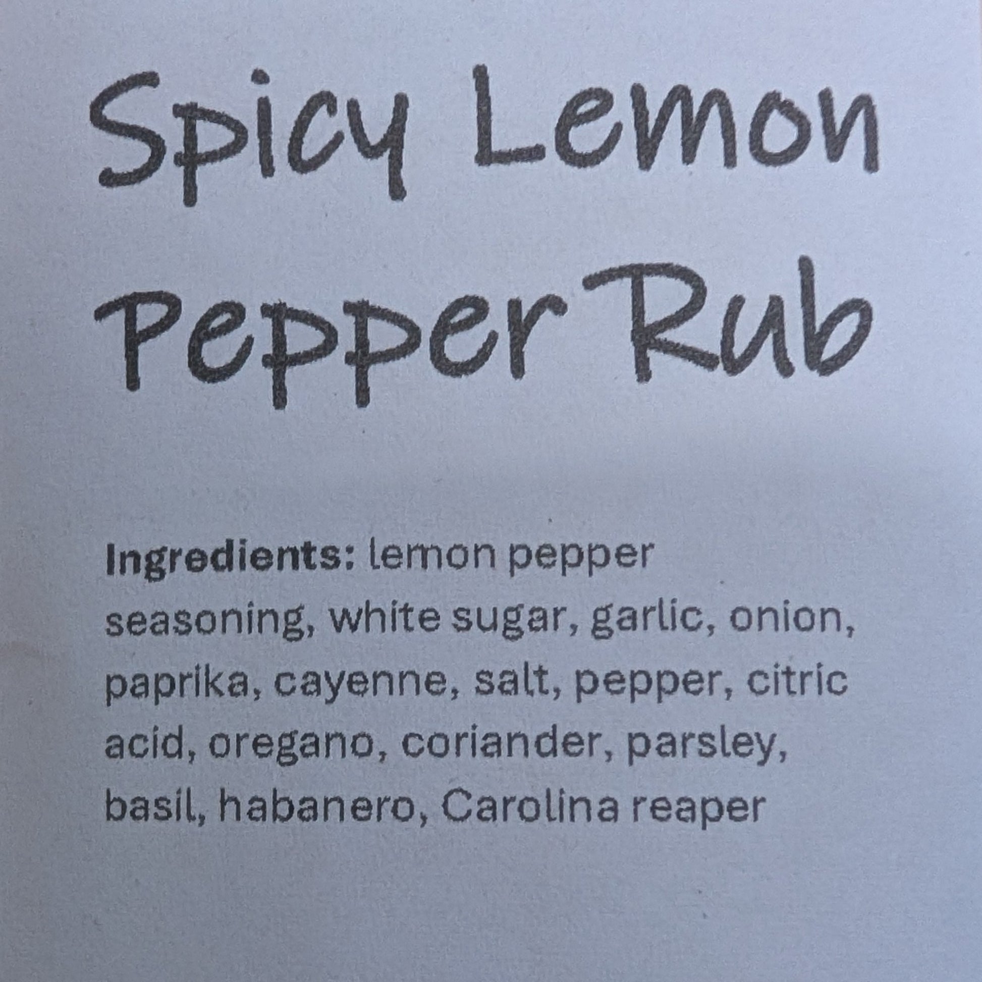 Spicy Lemon Pepper Rub packaging with label on a brown background