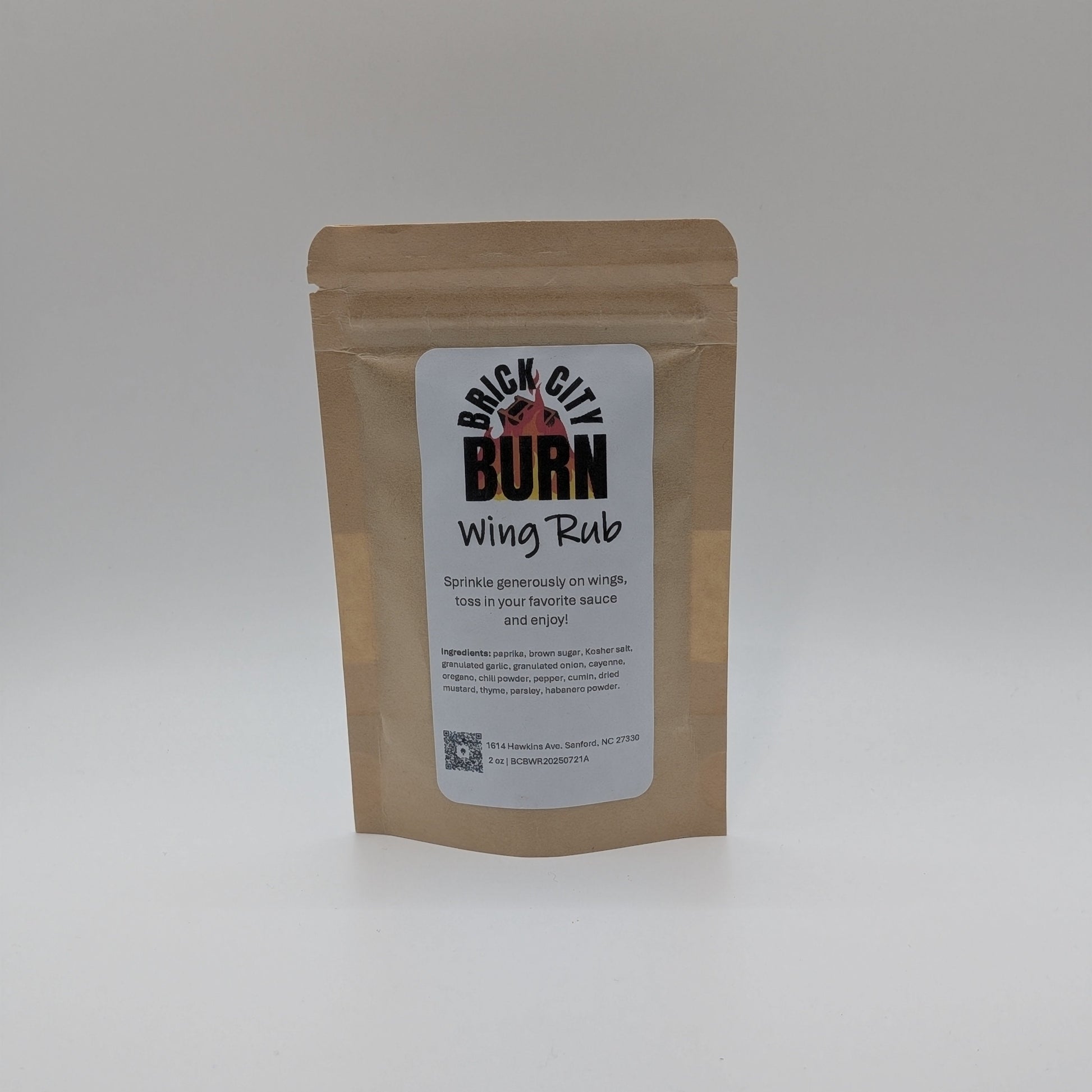 Brown packaging of Brick City Burn Wing Rub on a white background