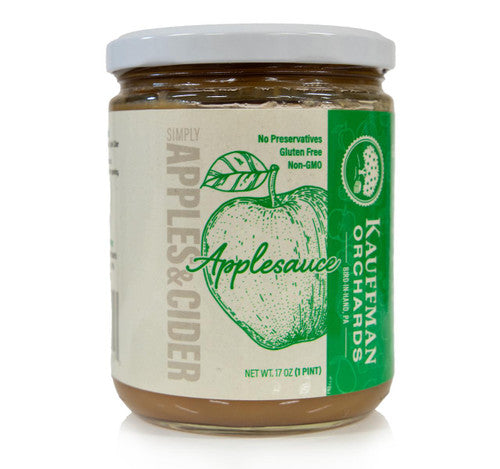 Jar of Kauffman Orchards applesauce with a green and white label on a white background