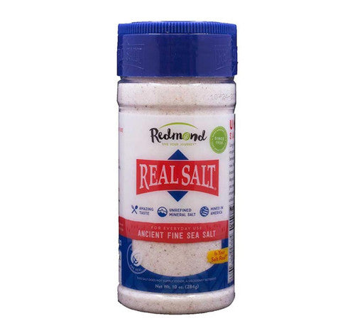 Jar of Redmond Real Salt on a white background
