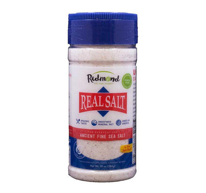 Jar of Redmond Real Salt on a white background